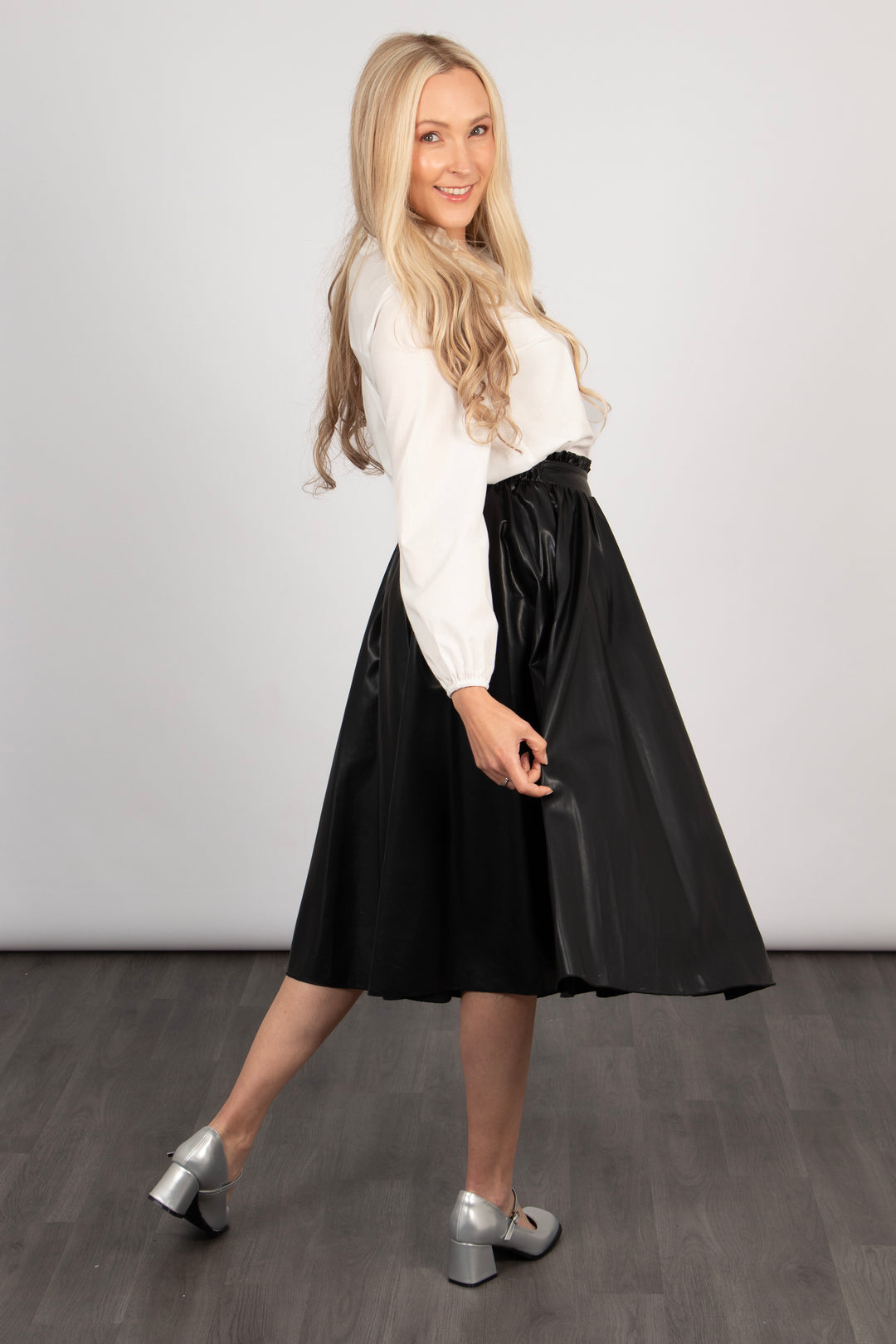 model showing the loose fitting faux leather skirt.