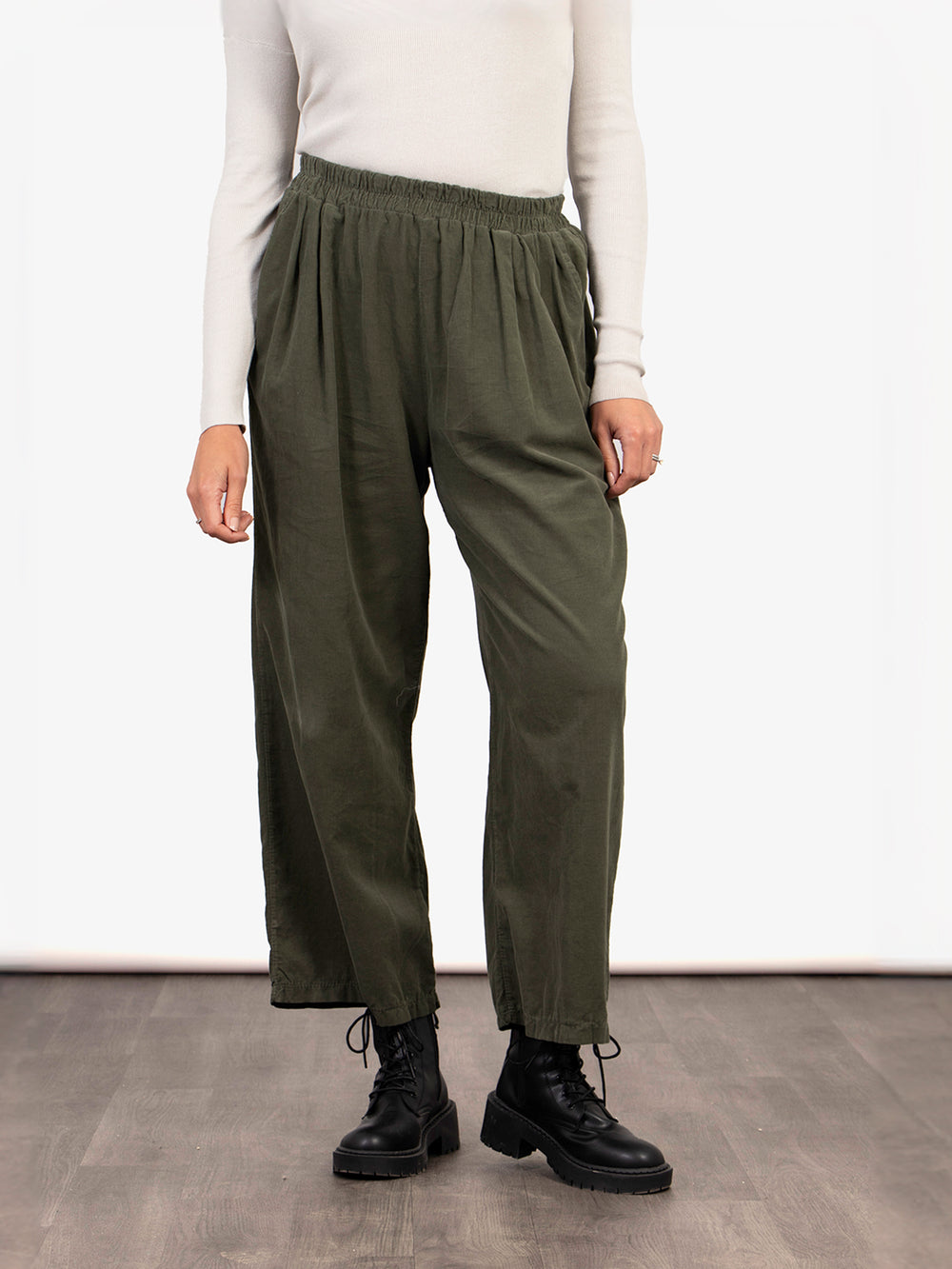 model wearing khaki green cropped wide leg trousers