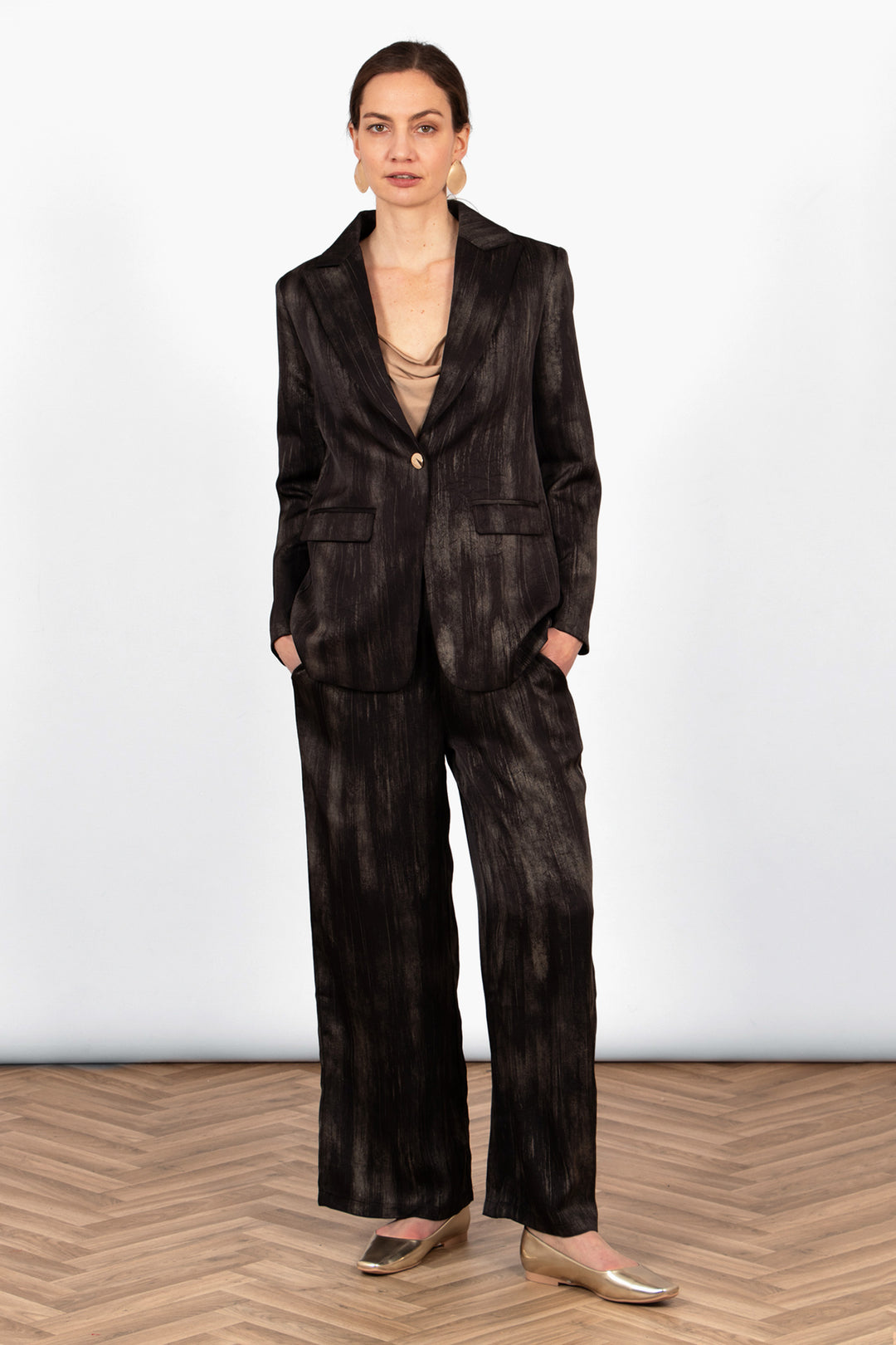 tatum-boyfriend-blazer-black-gold-metallic-brushstroke-on-model-paired-with-matching-trousers