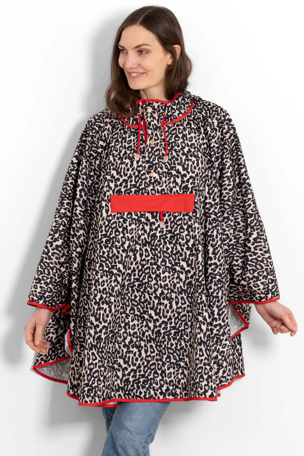 aspen-rain-poncho-cream-red-leopard-print-front-view-on-model