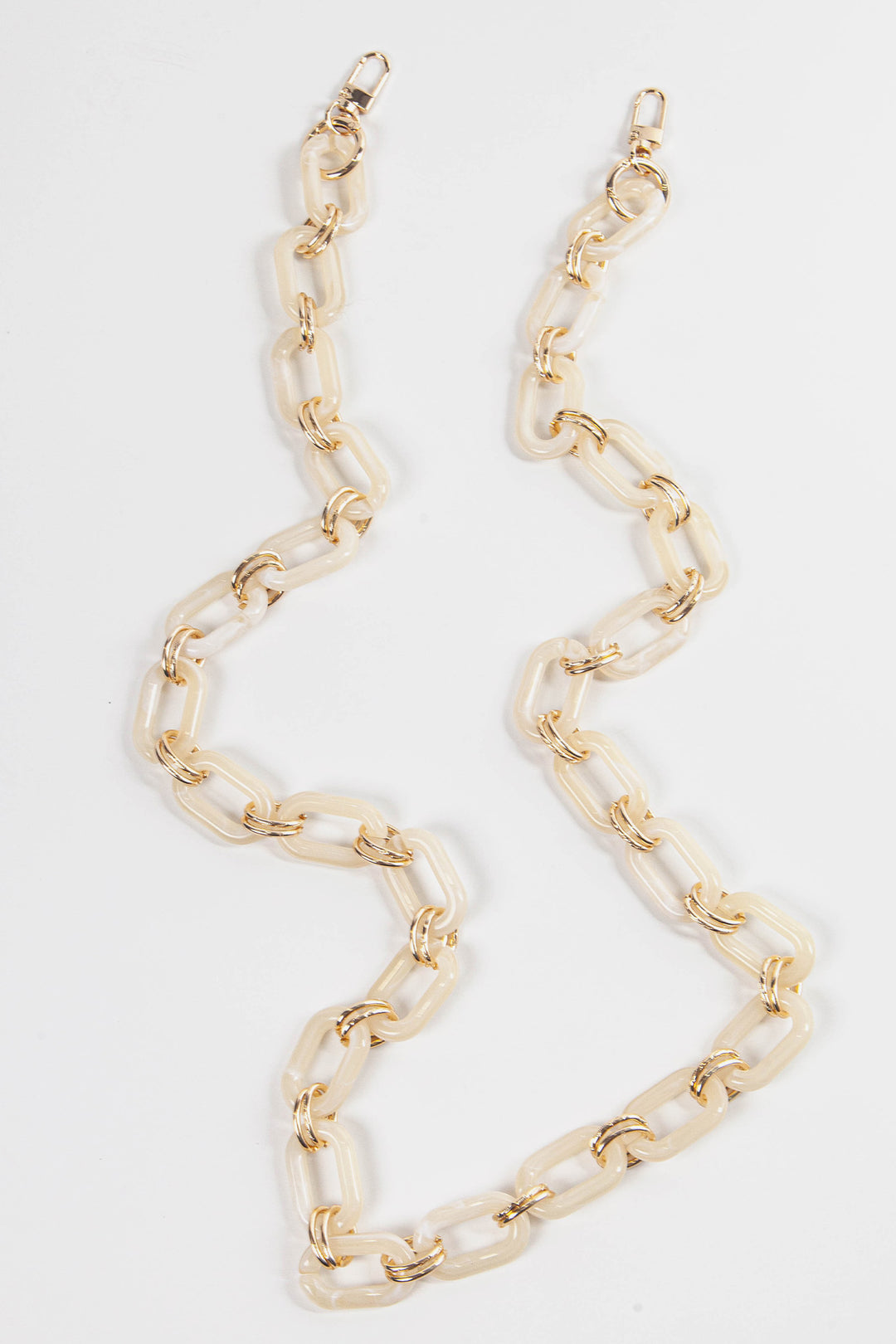 close up of the cream and gold link bag strap