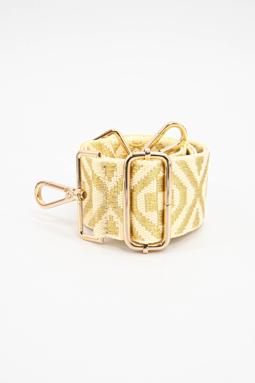 close up of the gold woven ikat pattern and gold adjustment buckle 