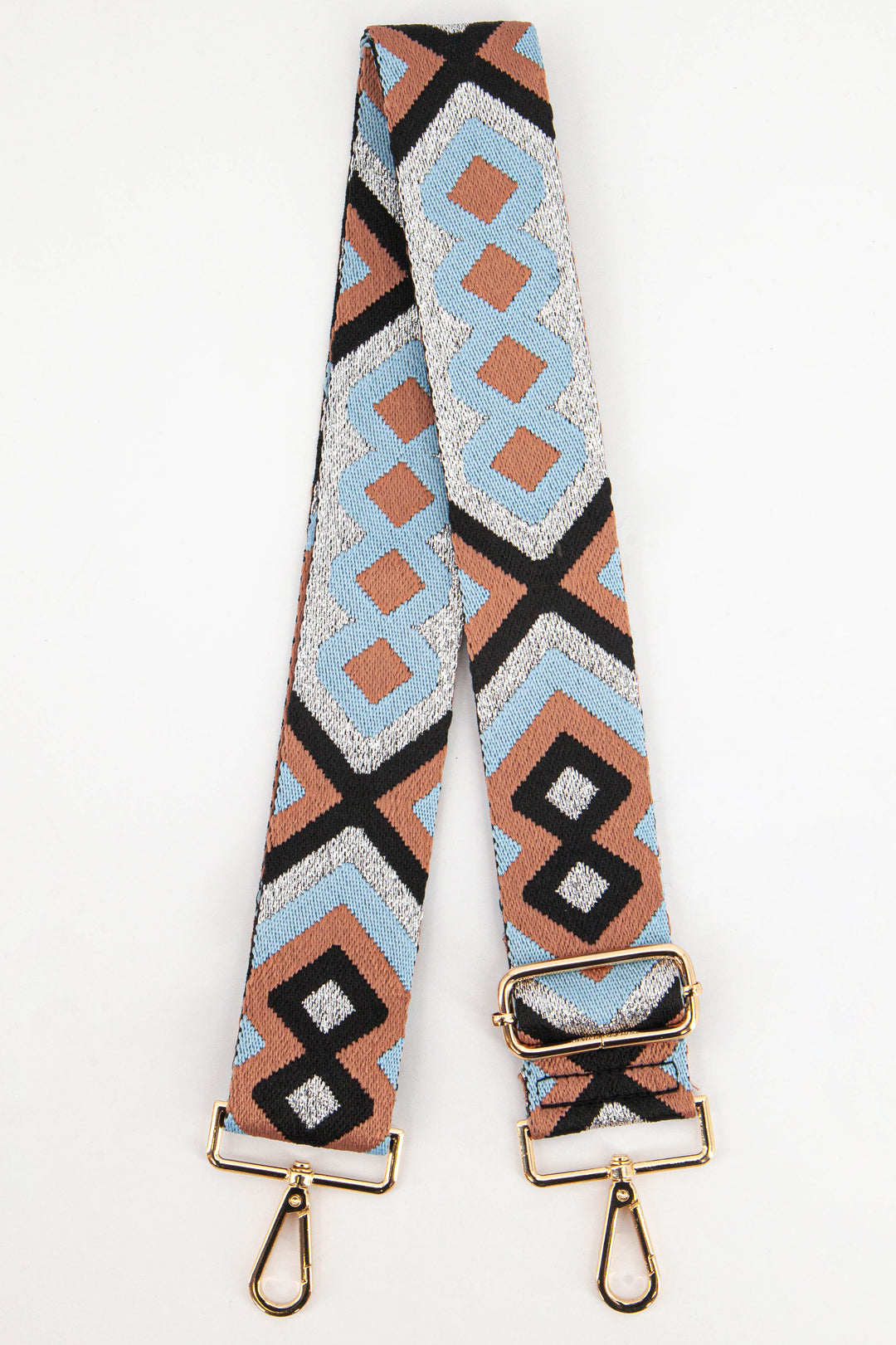 wide woven bag strap with a light blue and dusty pink aztec print with silver metallic glitter threading throughout