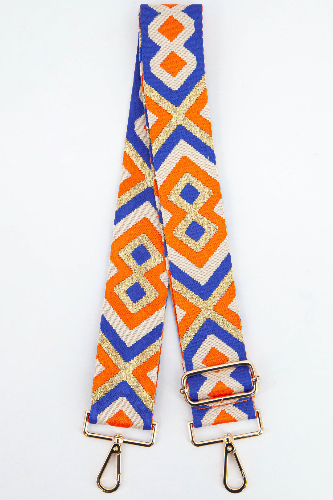 wide woven bag strap with a bold blue and orange aztec print with gold metallic glitter threading throughout