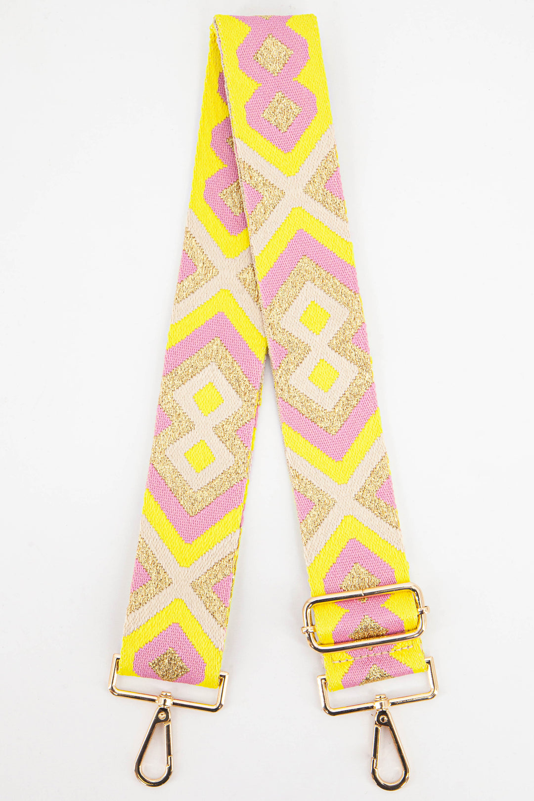 wide woven bag strap with a yellow and pink aztec print with gold metallic glitter threading throughout