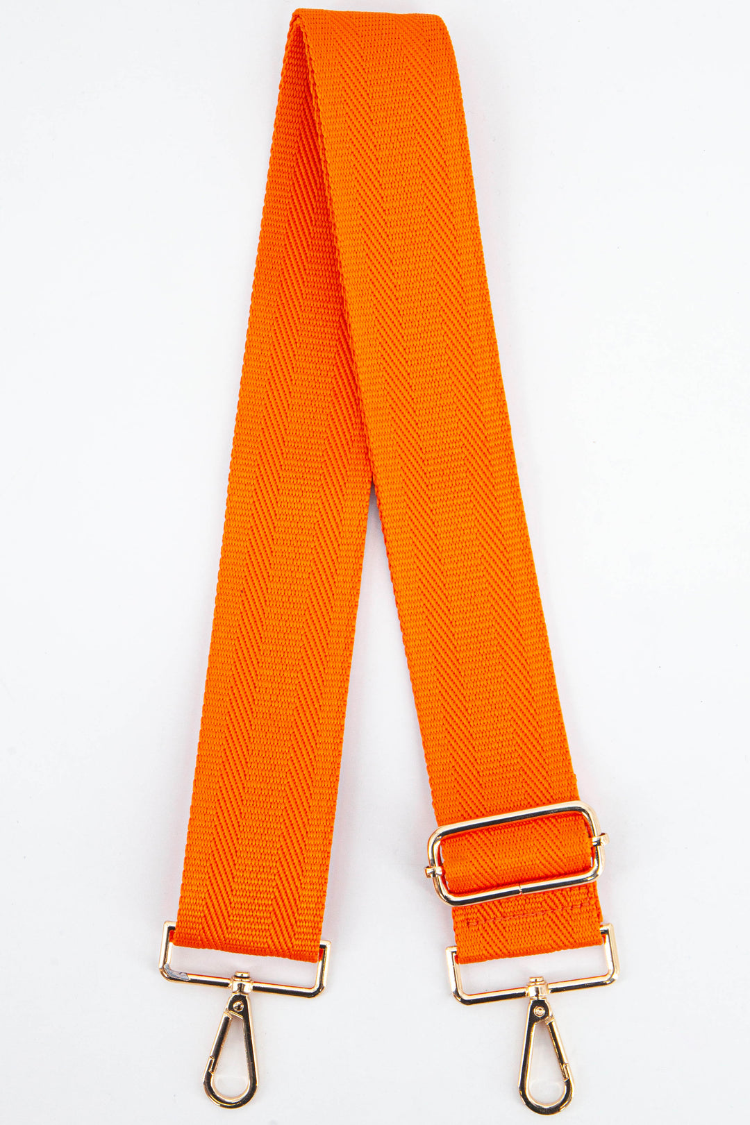 plain orange clip on bag strap in a textured orange woven material with gold hardware