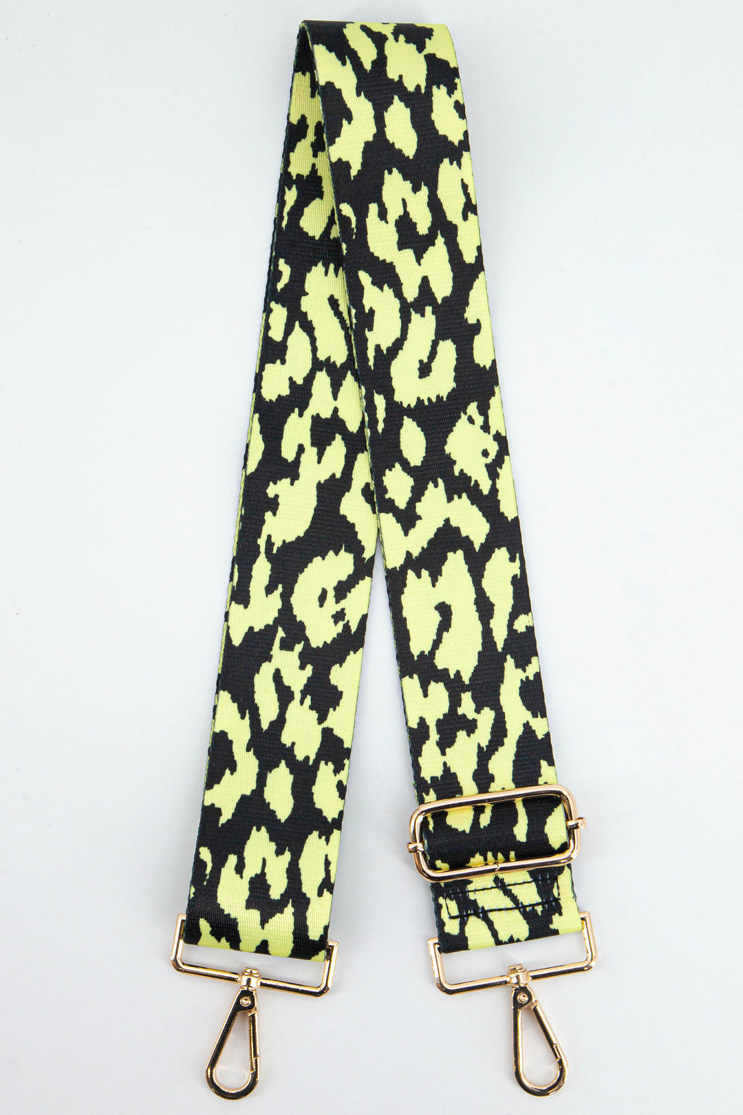 neon yellow and black animal print bag strap with gold clip on snap hooks and adjustable buckle