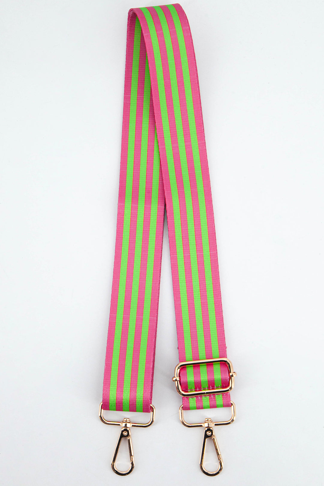 An adjustable bag strap with a bold contrasting lime green and pinkcoloured alternating stripe, finished with soft gold hardware.