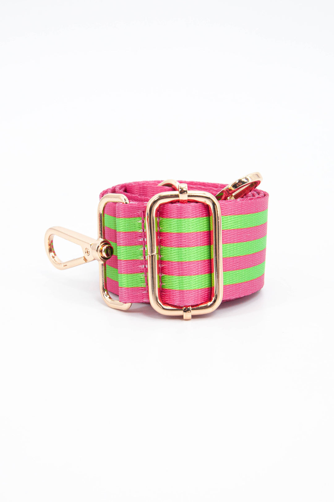 close up of the alternating pink and green stripe pattern and gold adjustment buckle