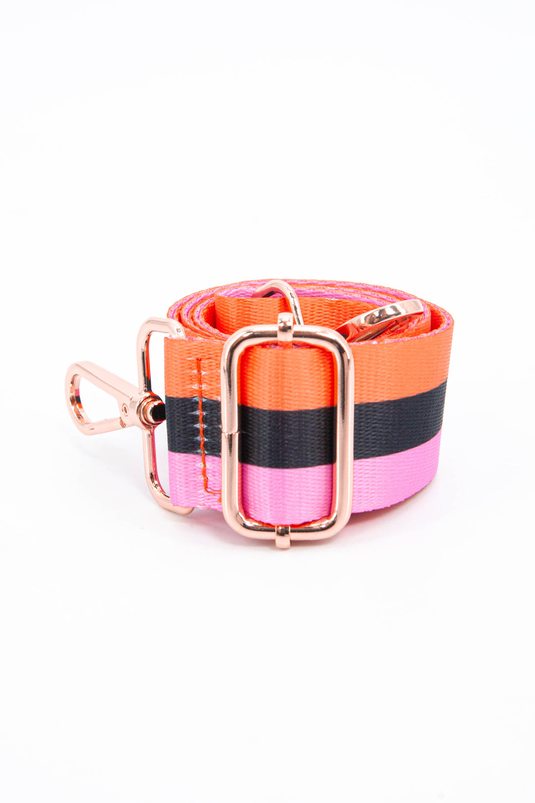 close up of the gold adjustable buckle and three contrasting stripes of orange, black and pink