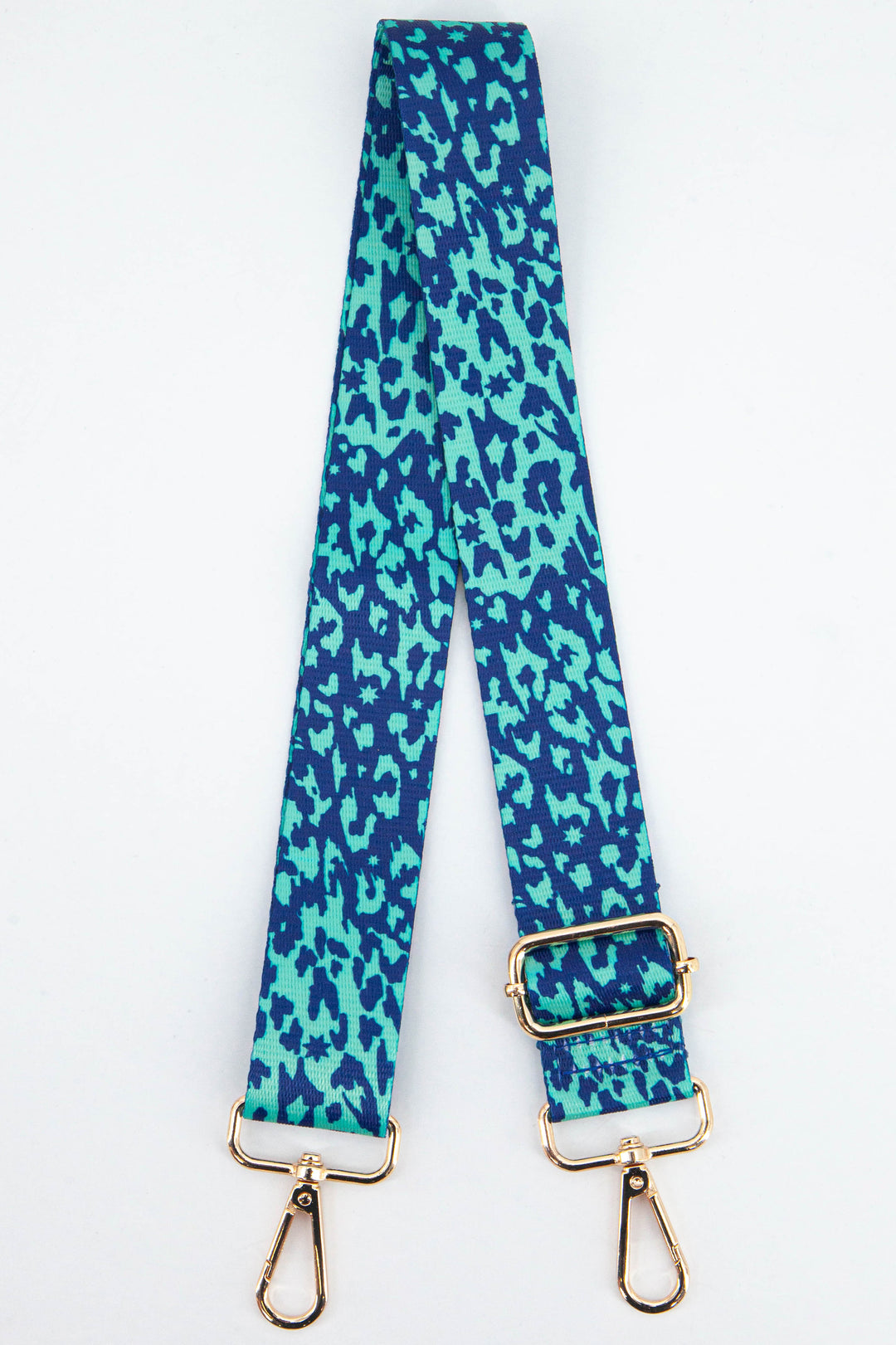 blue and turquoise green animal print bag strap with small stars and gold clip on hardware