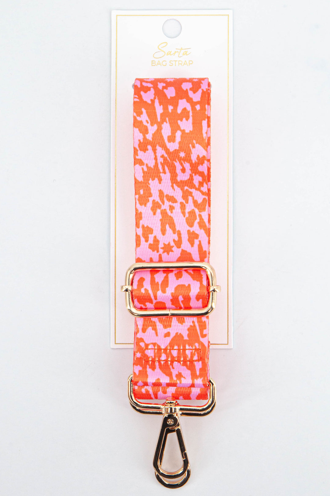 pink and orange animal and star print bag strap with gold hardware