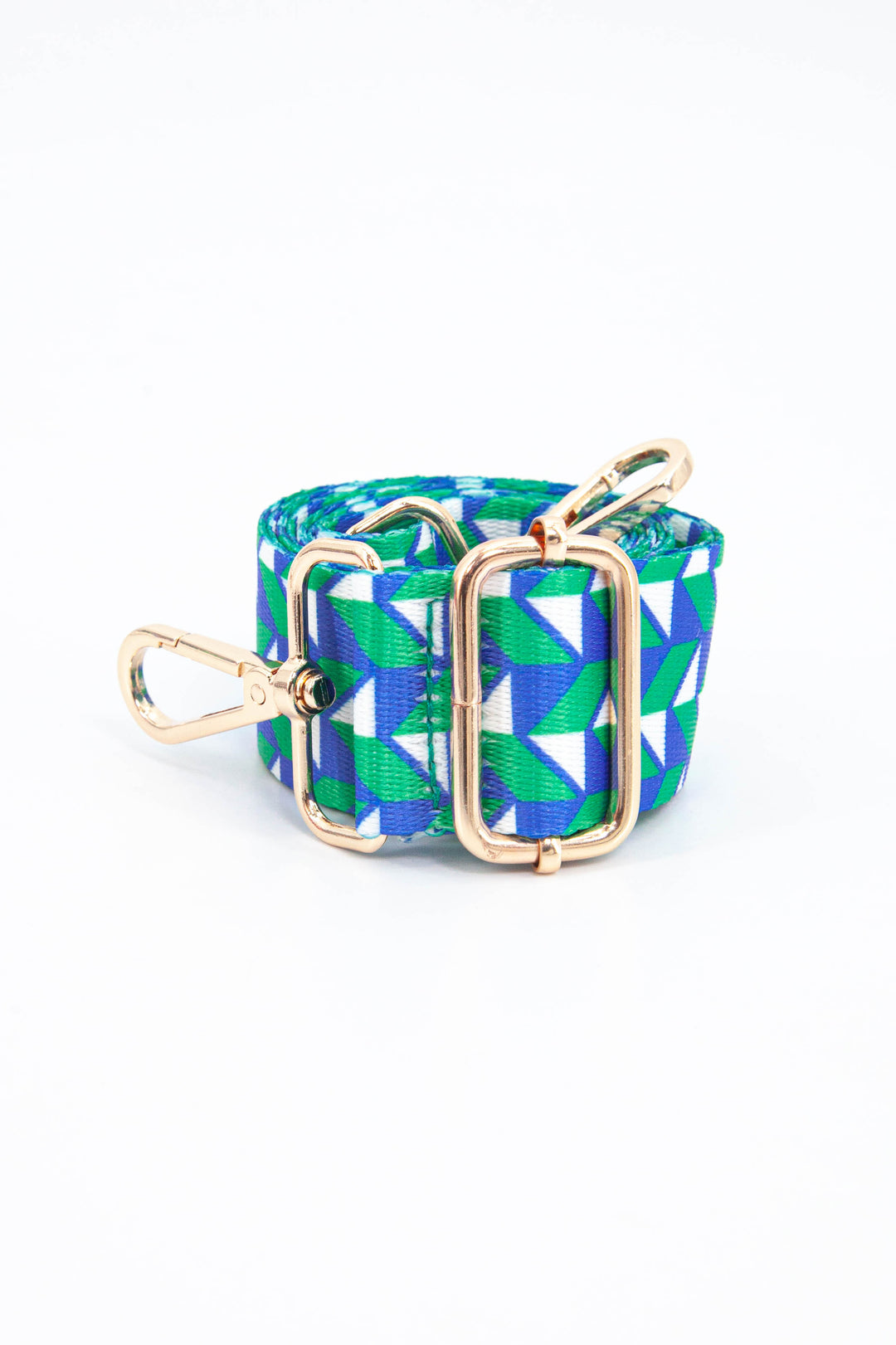 close up of the green and blue geometric chevron pattern and gold adjustment buckle