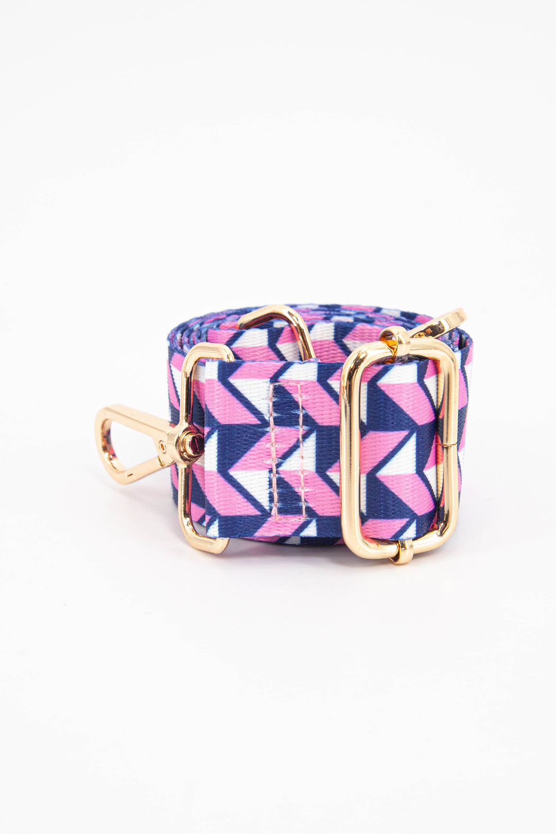 close up of the pink and navy blue geometric chevron pattern and gold adjustment buckle