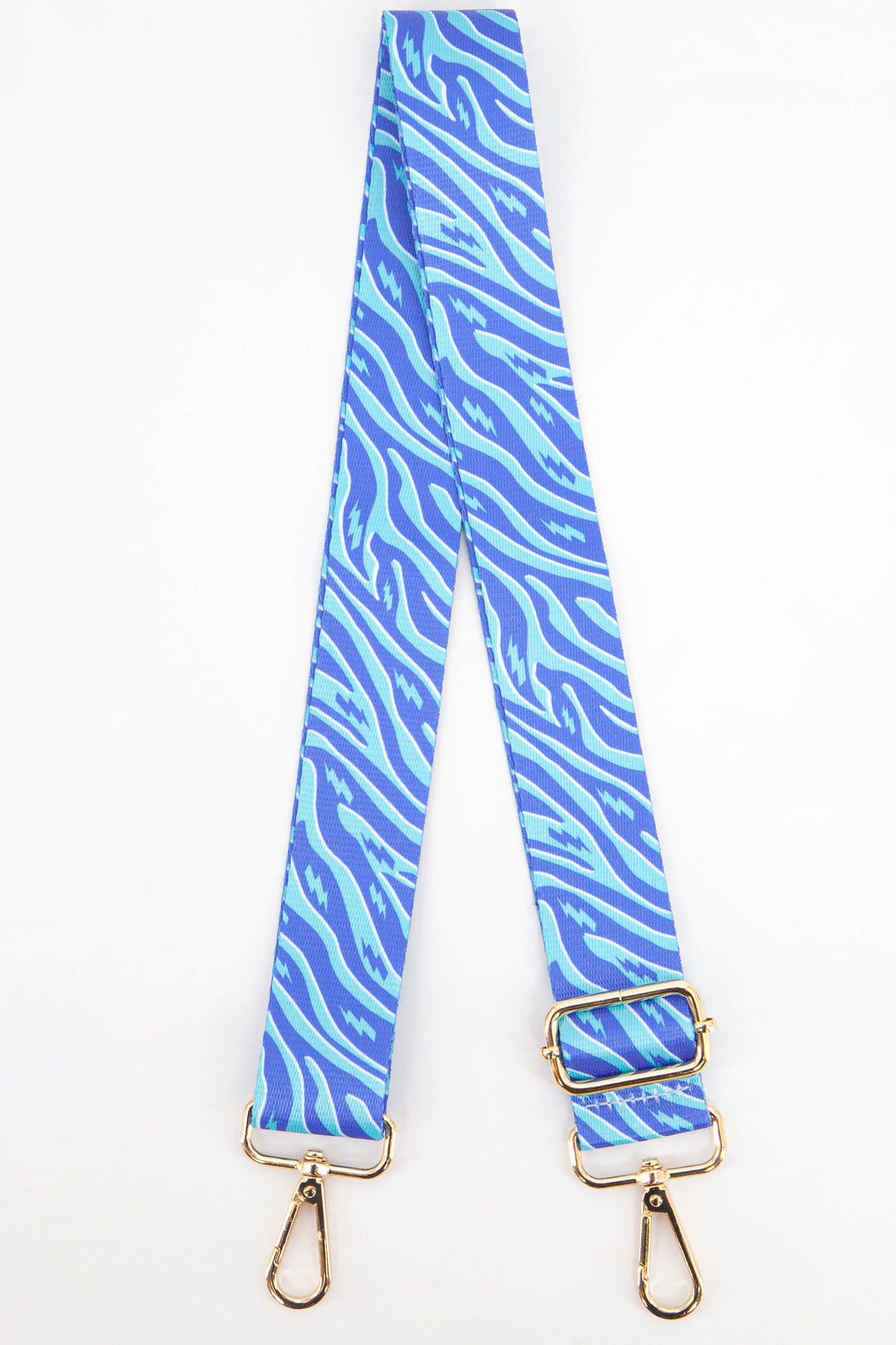 blue and turquoise zebra and lightning bolt pattern detachable bag strap with gold hardware