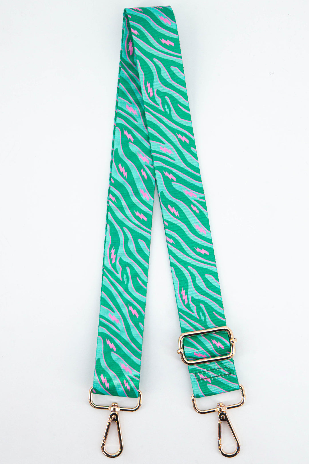 green zebra print bag strap with contrasting pink lightning bolts with gold metal clip on snap hooks