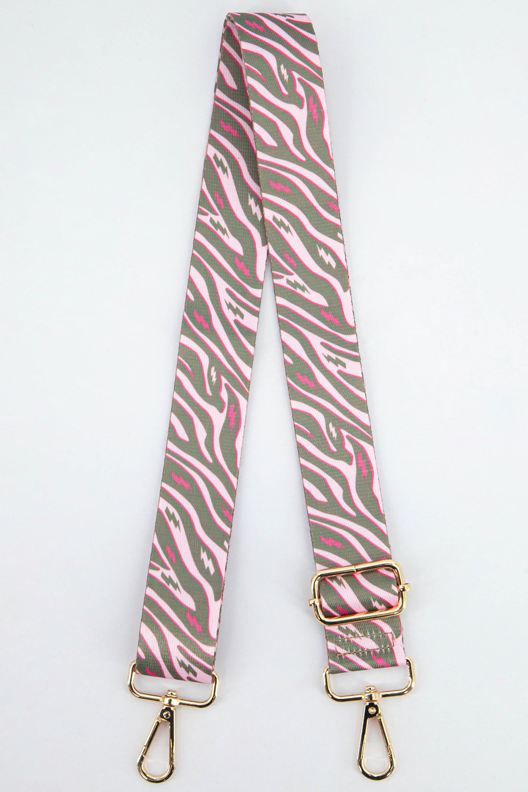 pink and khaki green zebra and lightning bolt print  bag strap with gold clip on snap hooks and an adjustable buckle