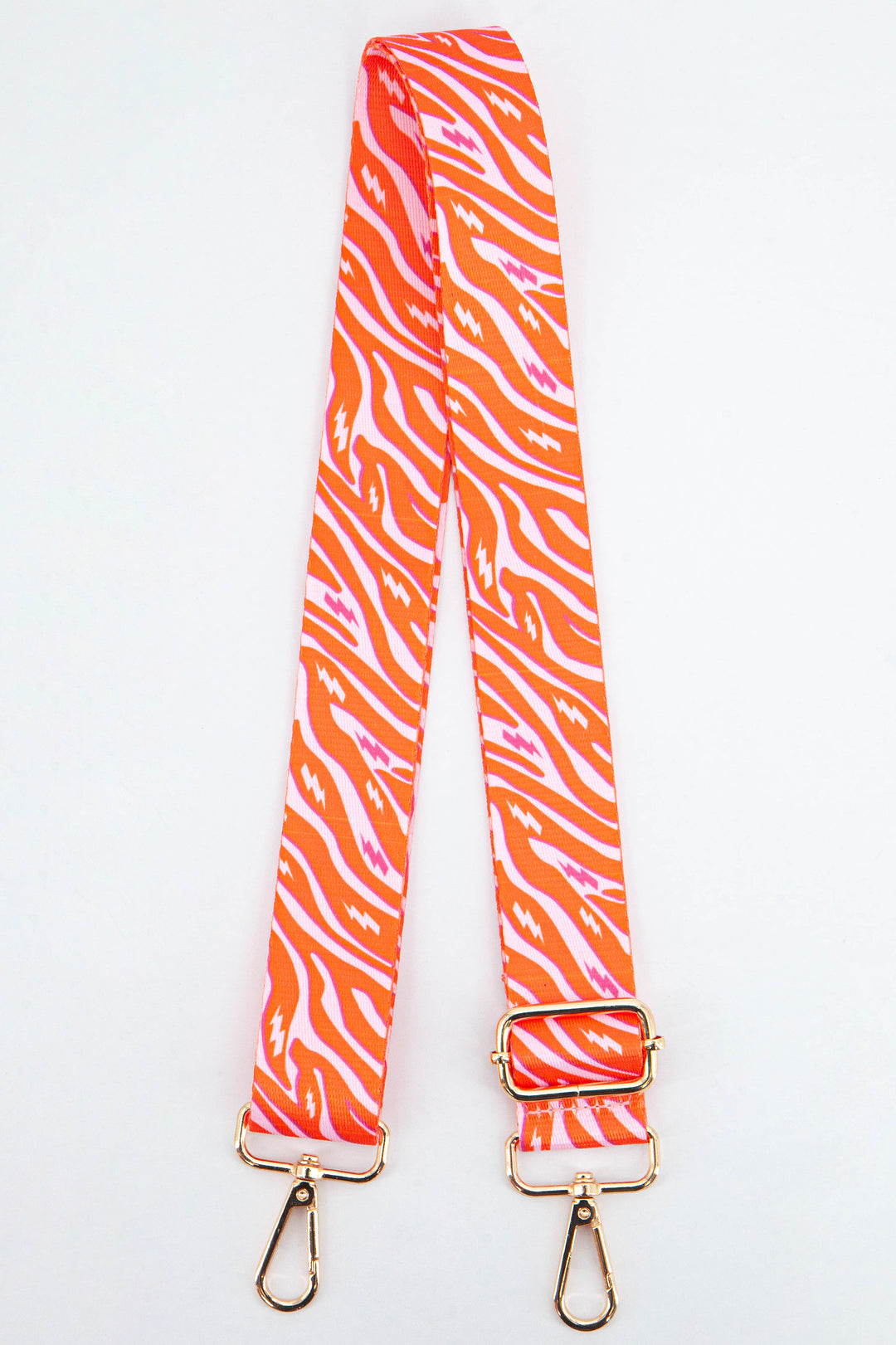 pink and orange zebra print bag strap with an all over pattern and contrasting lightning bolts