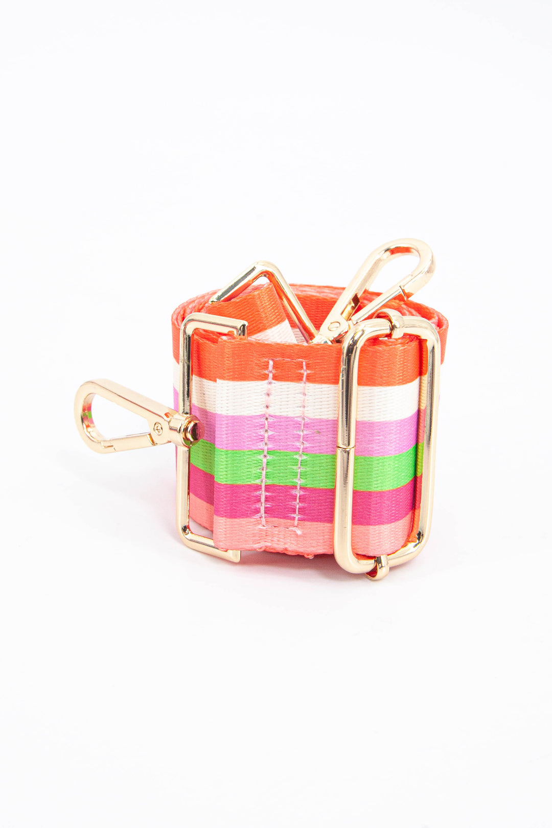 close up of the gold adjustment buckle and the multicoloured rainbow stripe pattern