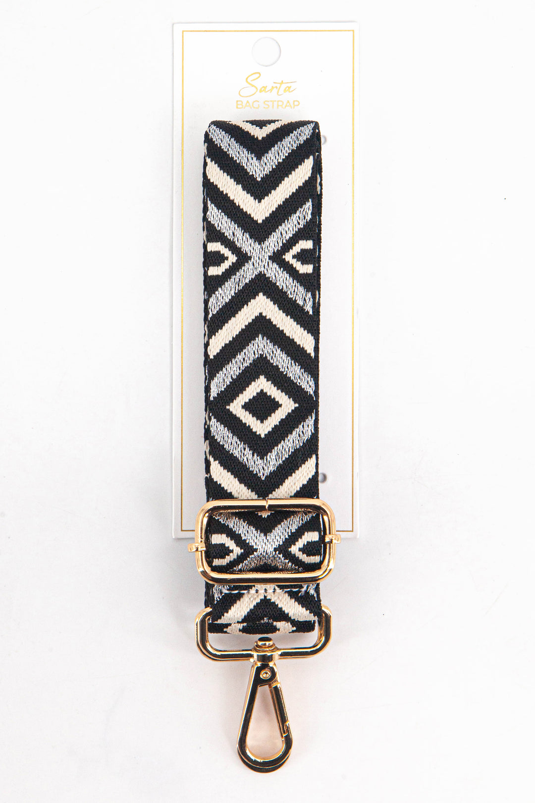 grey and silver aztec pattern woven bag strap in its sarta packaging