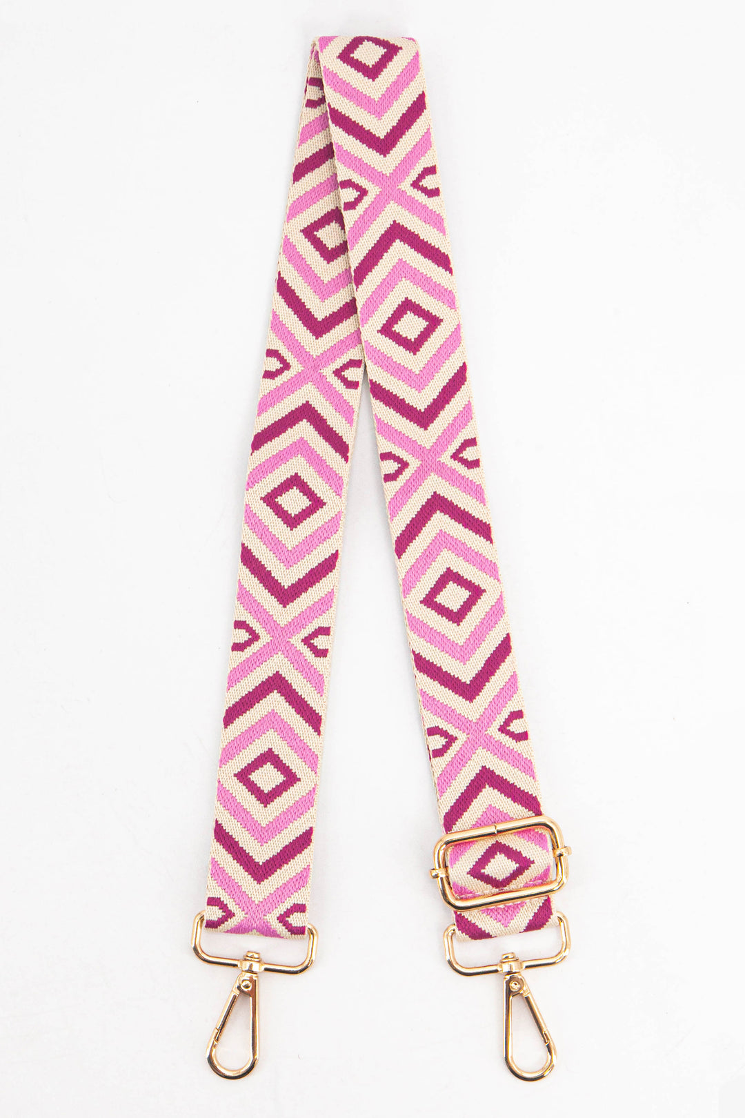 pink aztec print woven bag strap, the strap is adjustable and has gold hardware