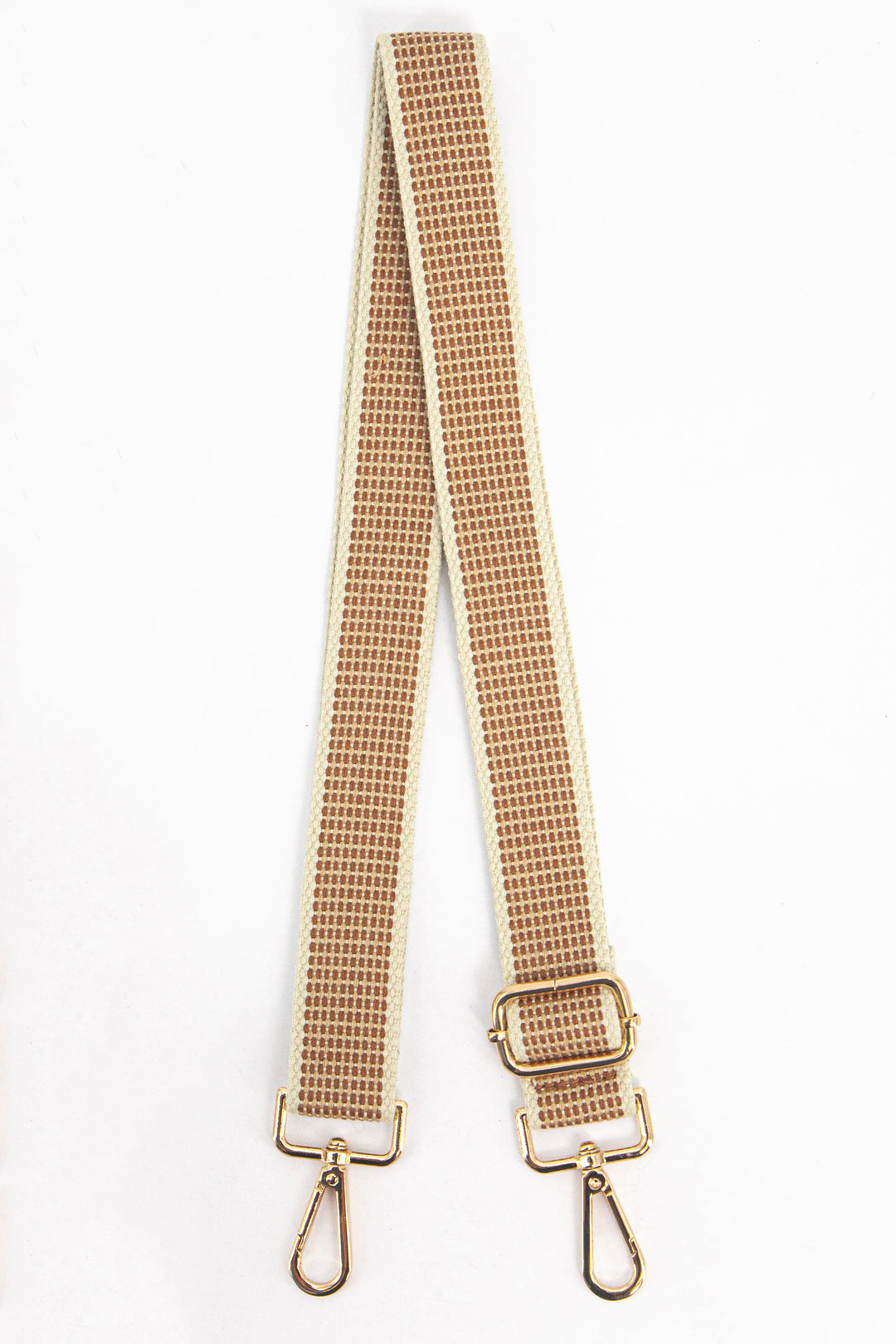 neutral tone bag strap with a rattan print pattern and gold hardware