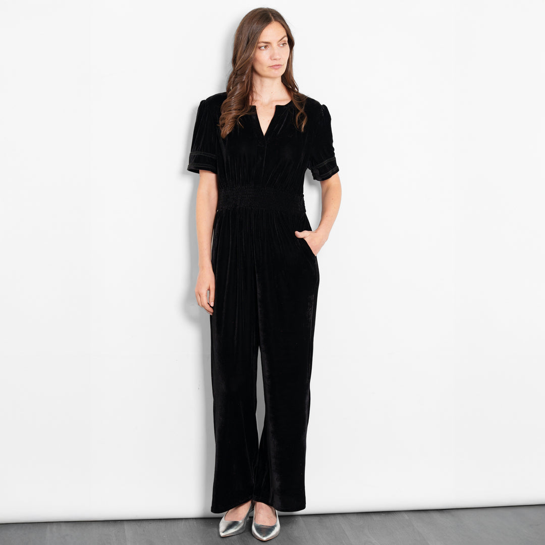 lydia-v-neck-jumpsuit-black-velvet-model-front-view-pockets