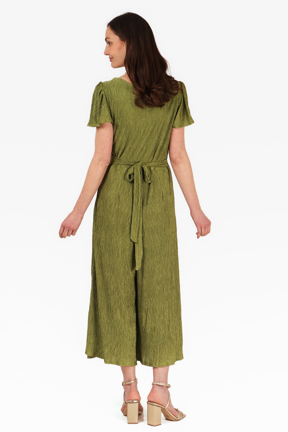 model wearing an olive green plisse fabric jumpsuit with v neck and short angel sleeves