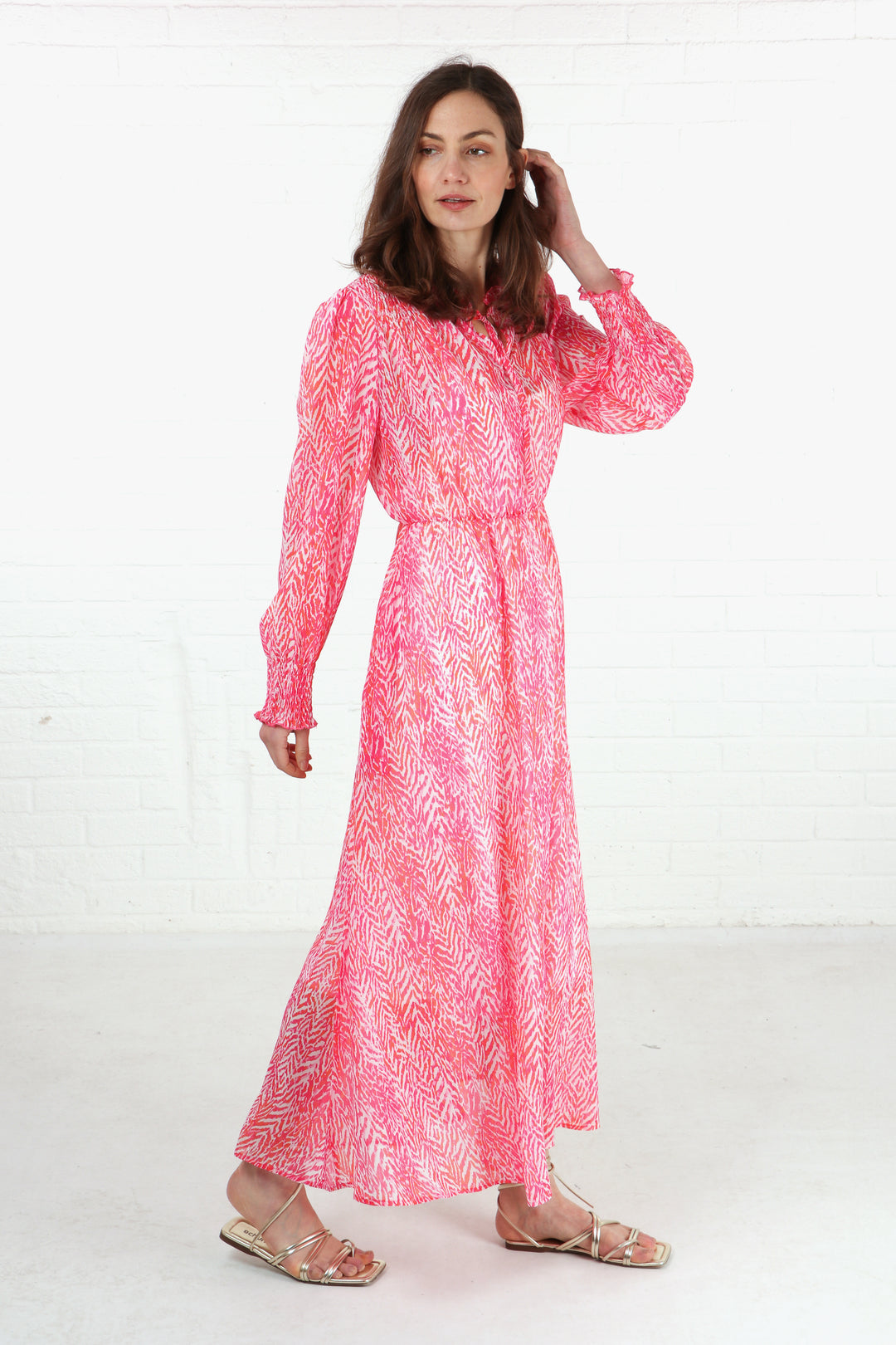 long sleeve chiffon midi dress with an all over pink chevron print 