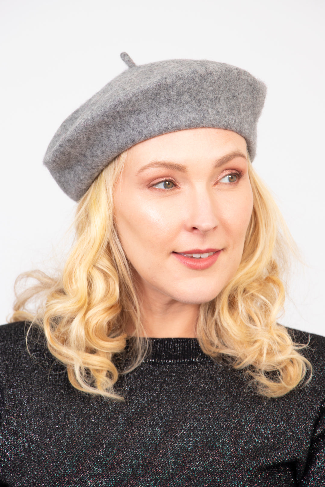 model wearing a grey knitted woolen beret hat