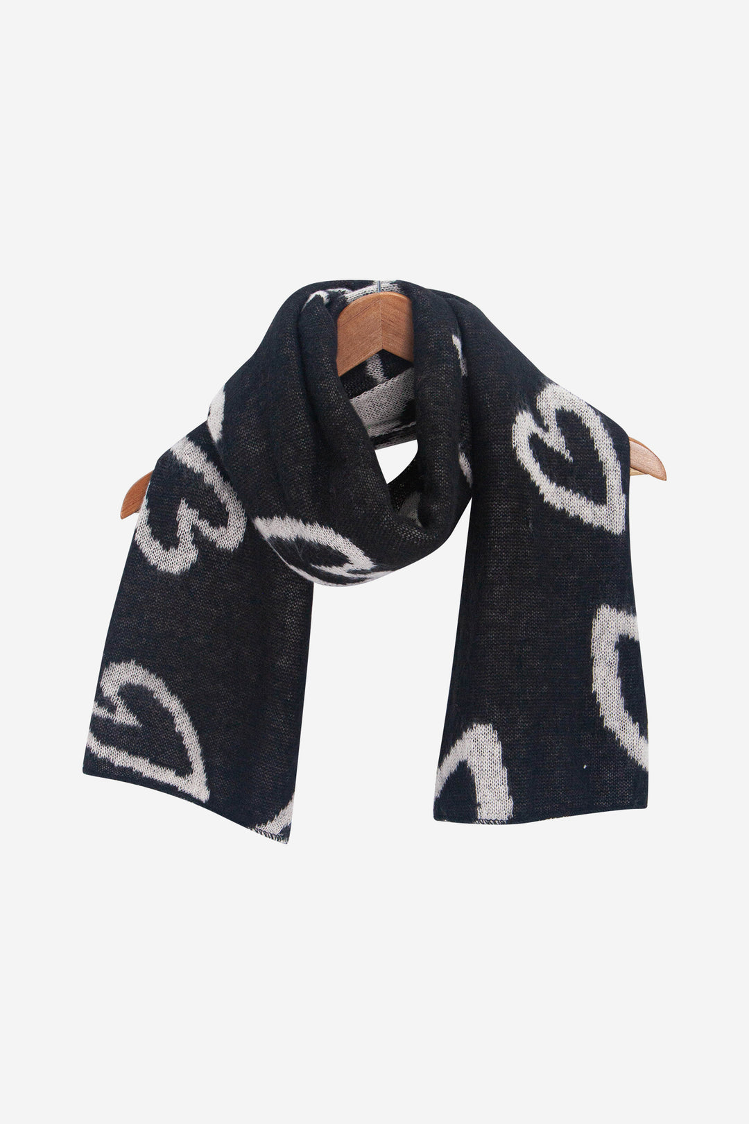 zuri-black-white-sketched-hearts-heavyweight-scarf-draped-on-coat-hanger