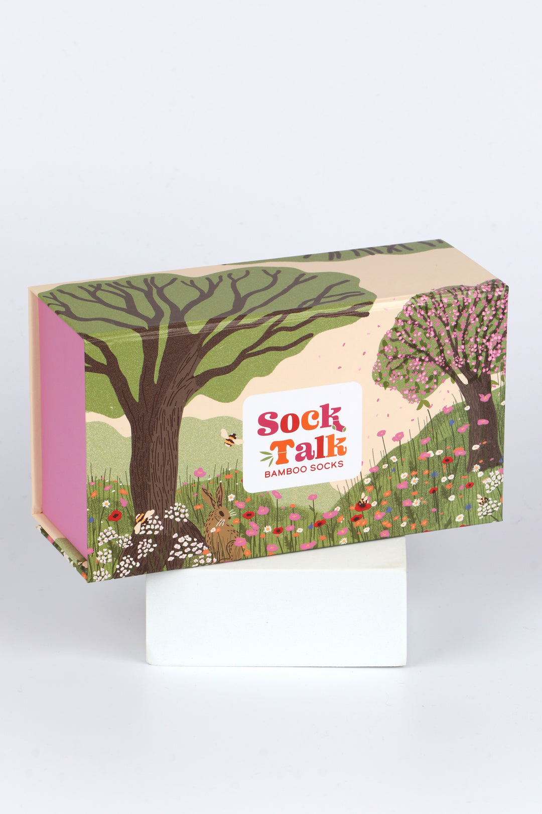 sock talk gift box designed to look like a summer meadow with wild flowers and cherry blossom trees 