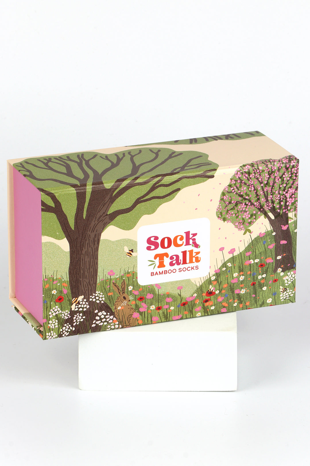 sock talk gift box designed to look like a summer meadow with bees, flowers and trees
