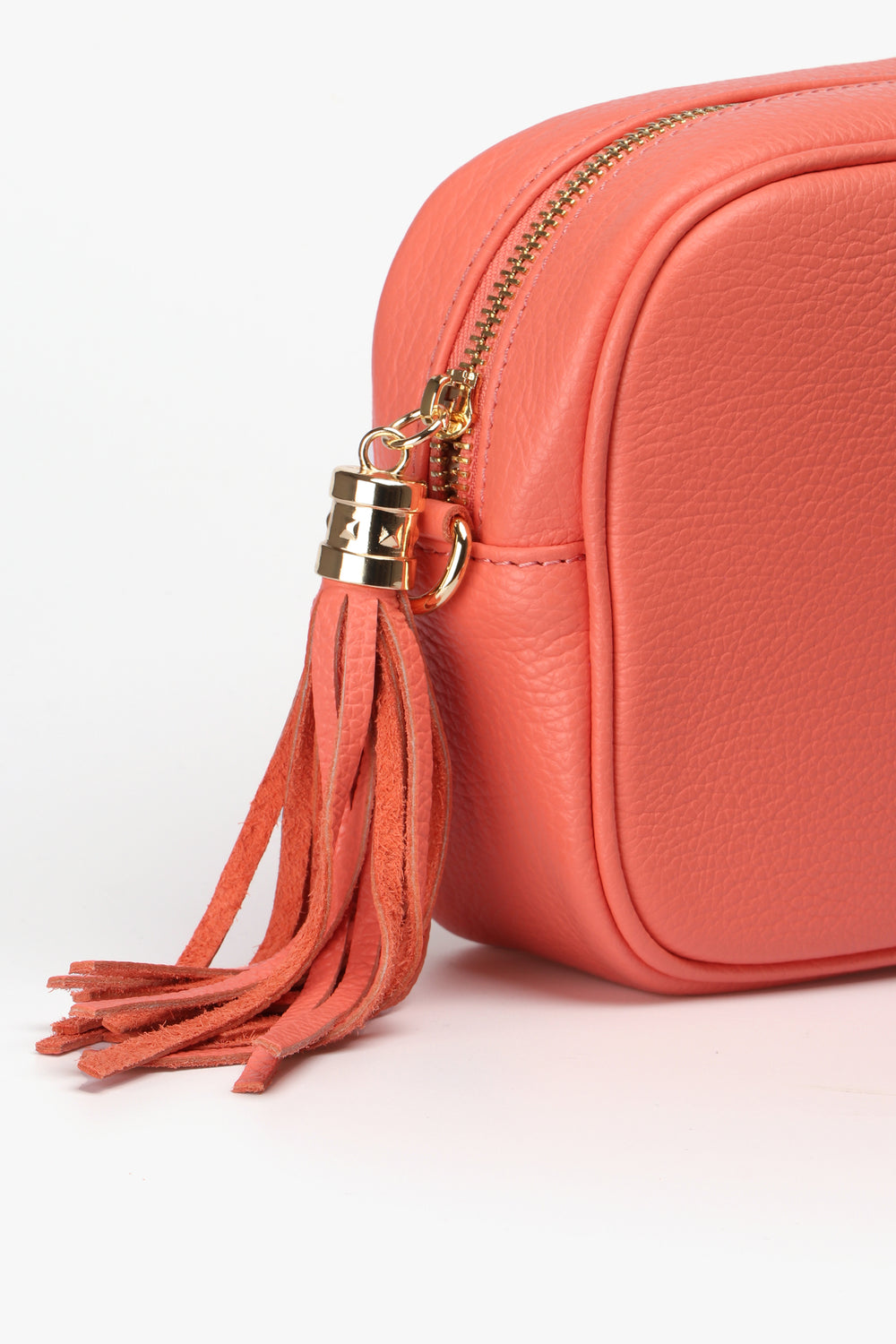 close up of the leather tassel on on the zipper closure of the camera bag