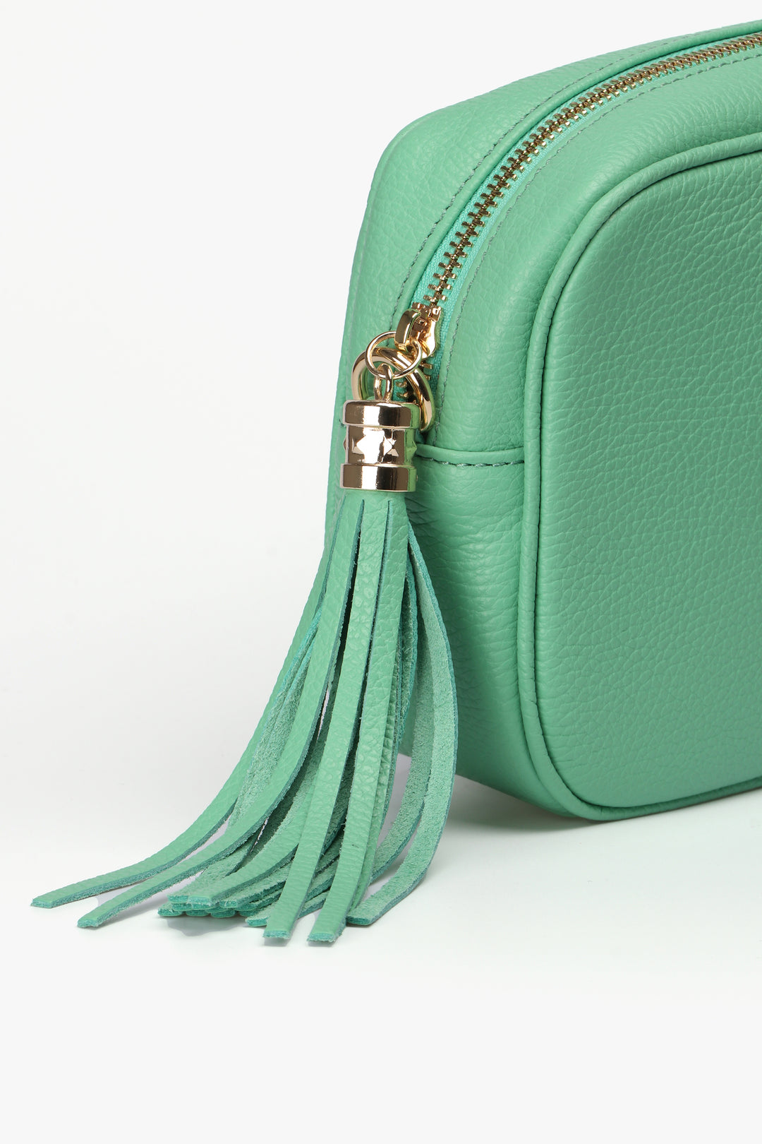 close up of the leather tassel on on the zipper closure of the camera bag