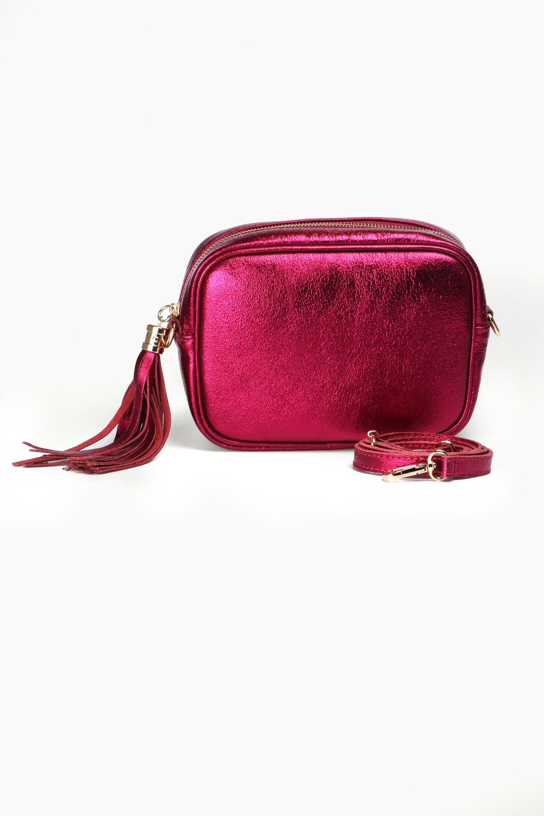 magenta pink metallic crossbody camera bag with a decorative tassel and gold zip closure