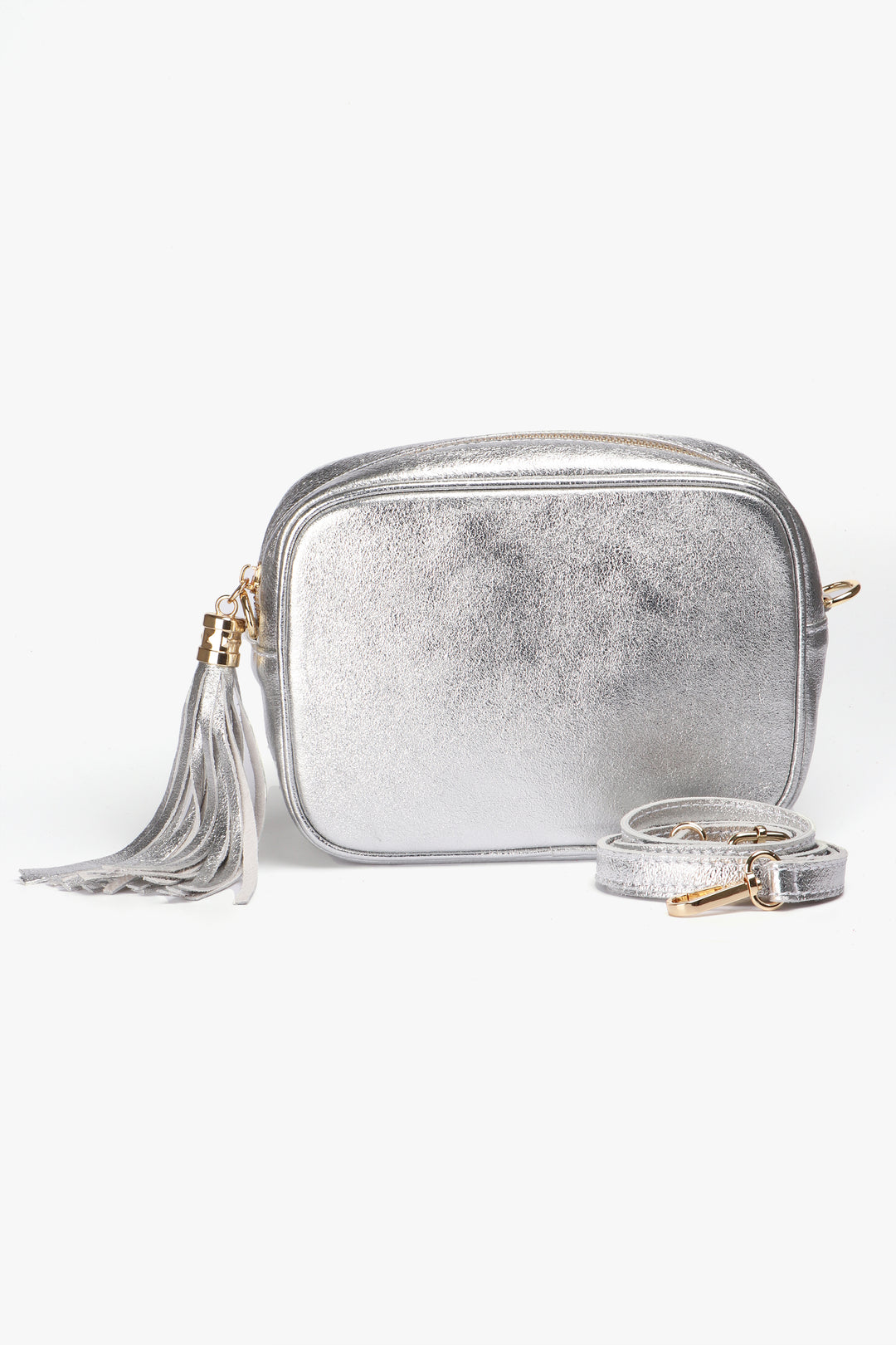 silver crossbody camera bag with a detachable adjustable bag strap, zip closure and tassel