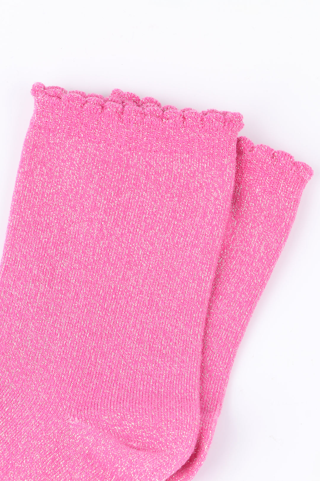 close up of the fuchsia pink socks, showing the all over glitter sparkle