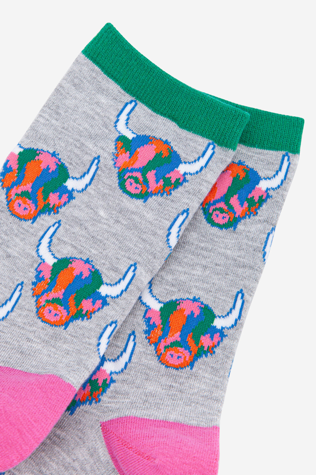 womens grey ankle socks with green cuff and pink heel with an all over pattern of multicoloured highland cow faces
