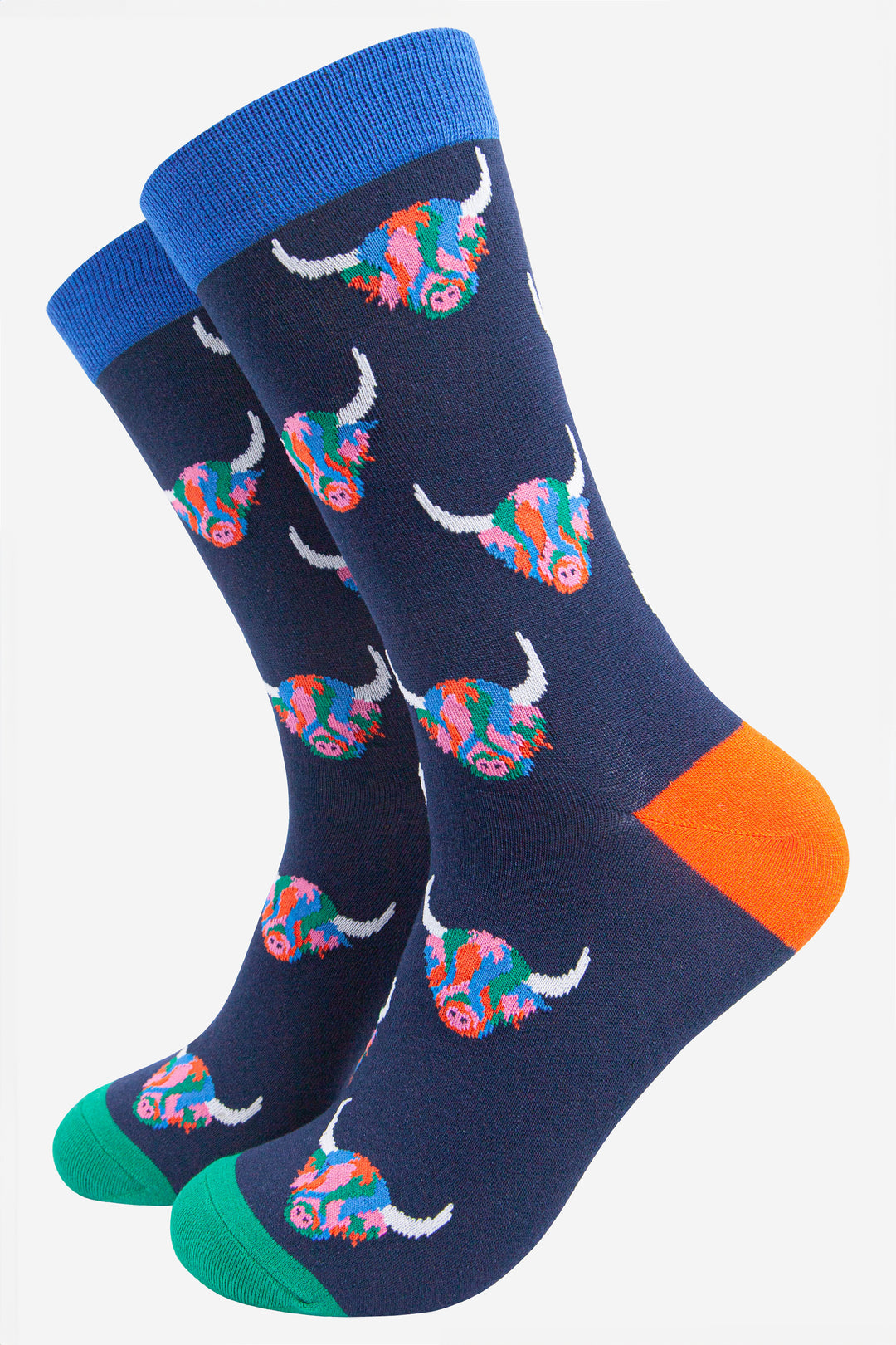 navy blue socks with a pattern of rainbow highland cows