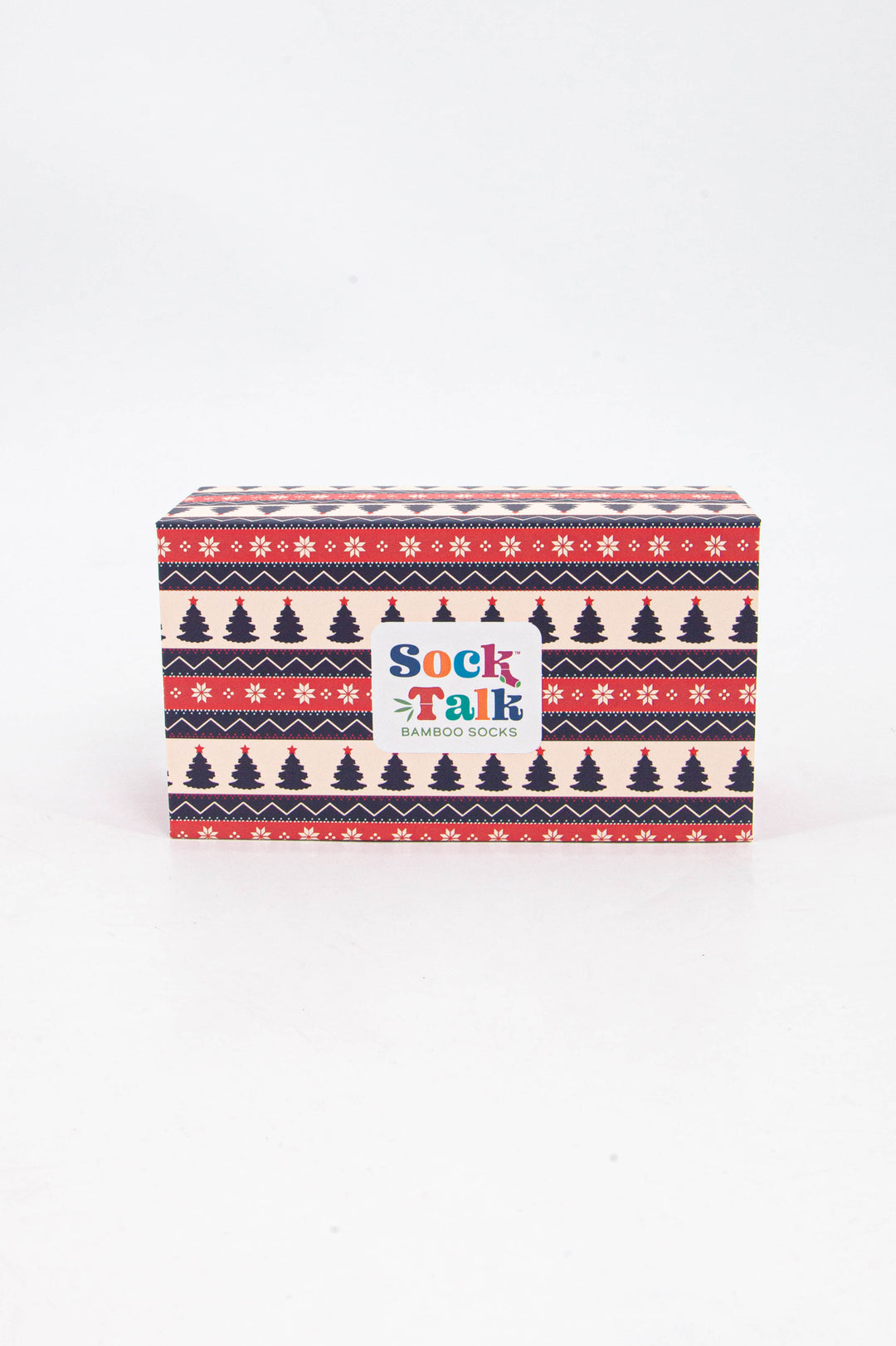 cream, red and blue fair isle design gift box featuring xmas trees and snowflakes