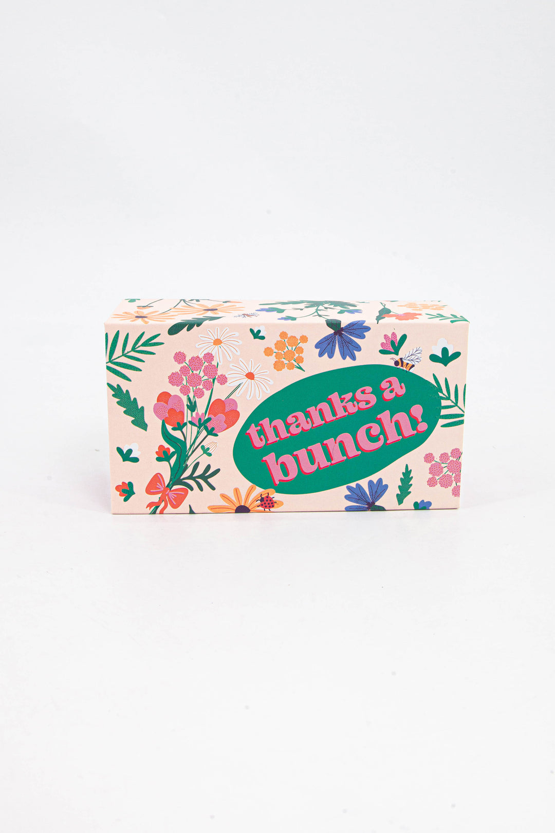 cream and multicoloured floral pattern gift box with the phrase "thanks a bunch" boldly printed on it