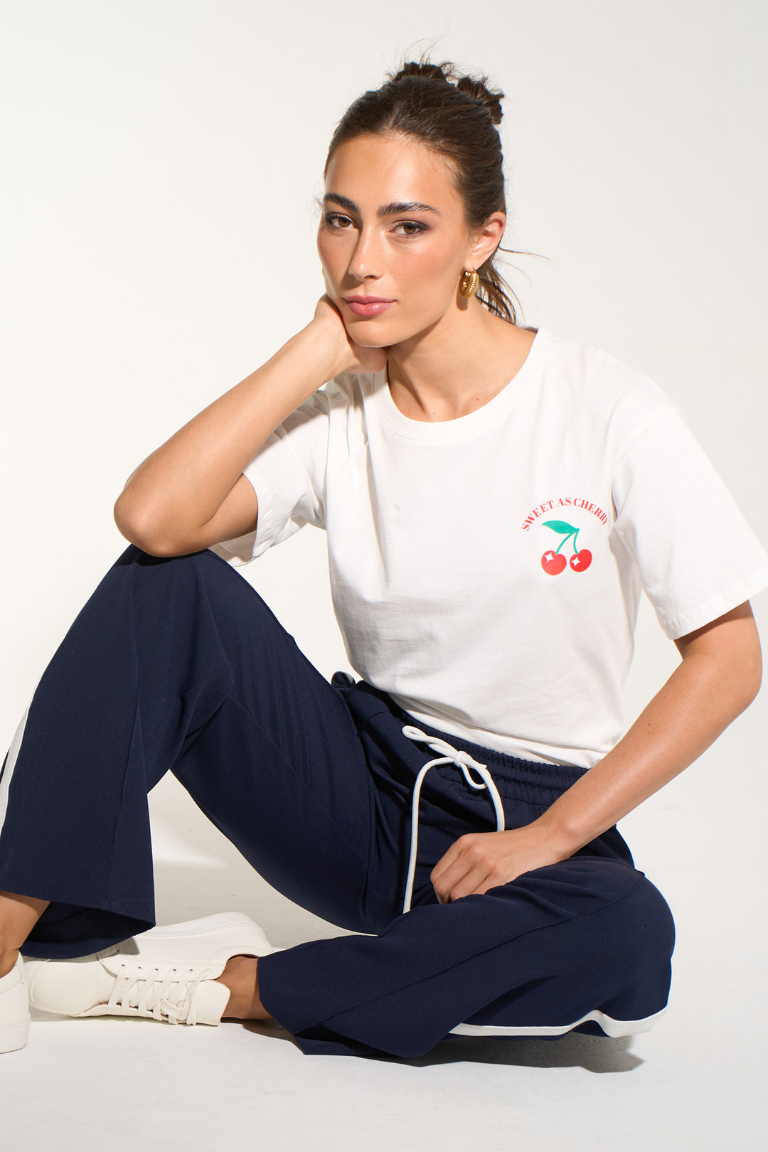 sweet-cherries-short-sleeve-cotton-t-shirt-in-white-model-seated