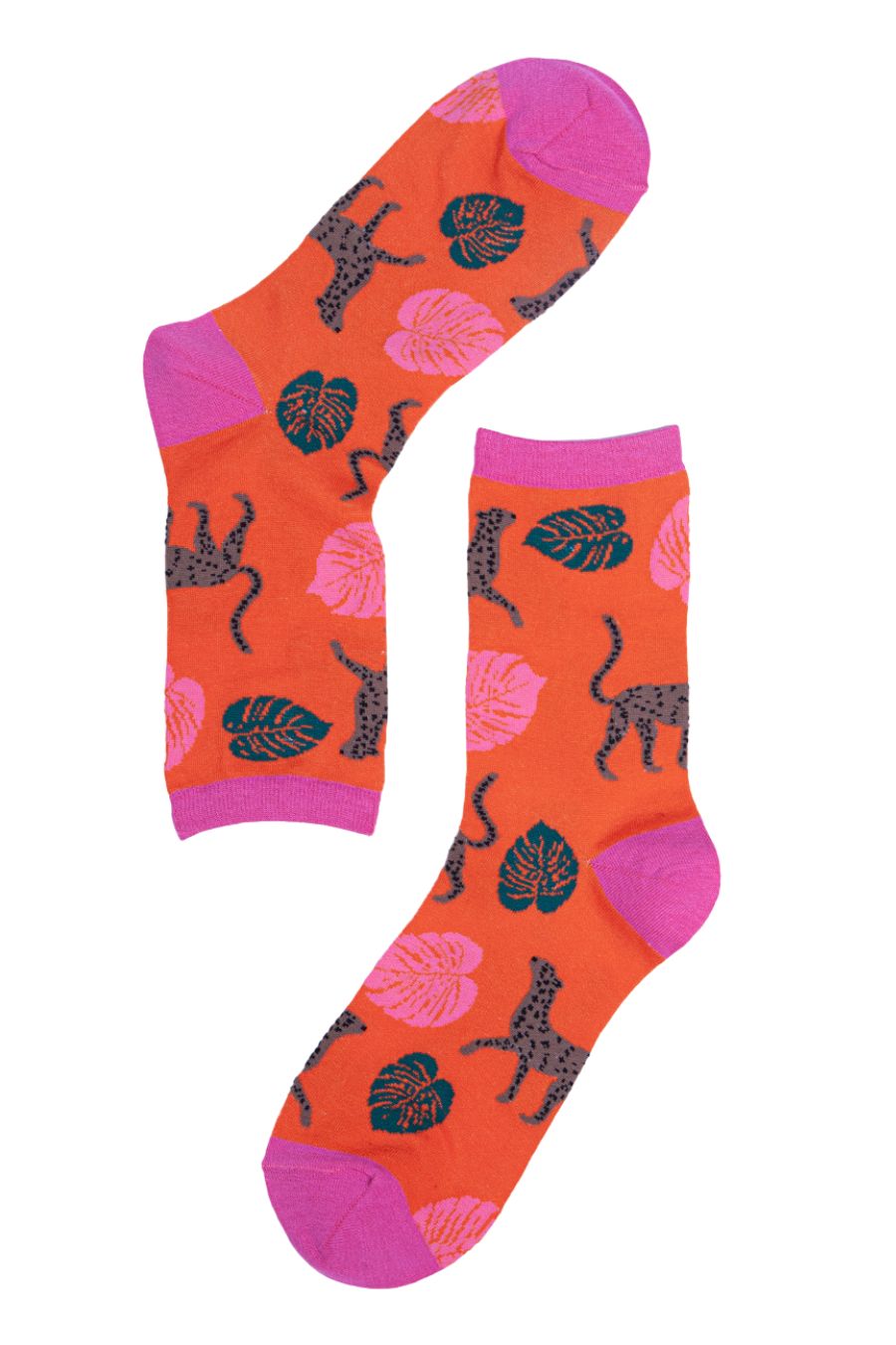 close up of the cheetah and leaf print pattern on the orange ankle socks