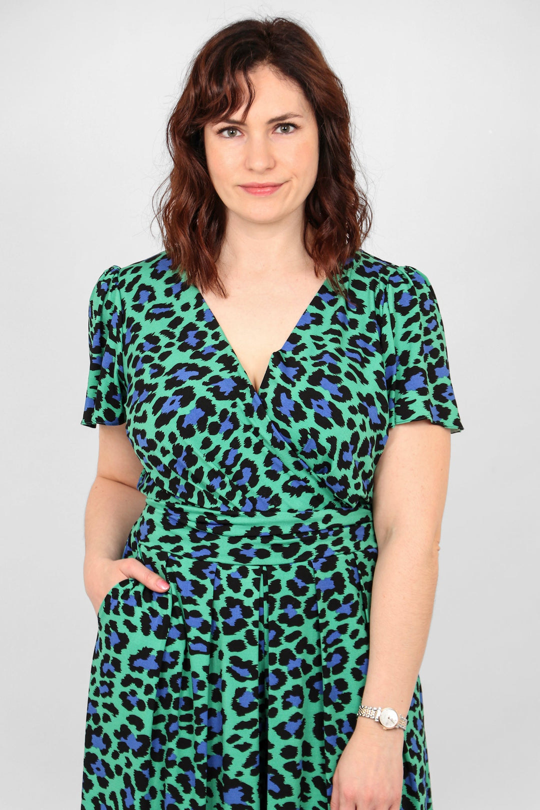 Close up of green and navy blue leopard print jumpsuit