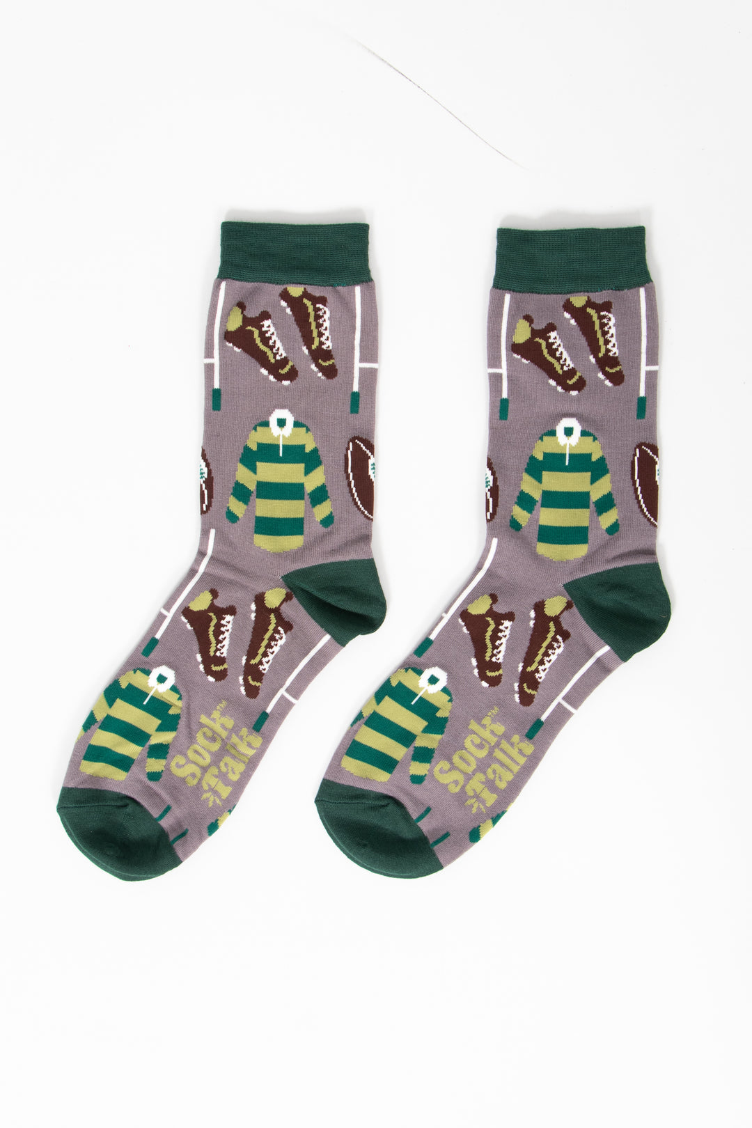 showing the socks laying flat, they have a grey background and dark green heel, toe and cuff. the rugby themed pattern covers the whole of the design