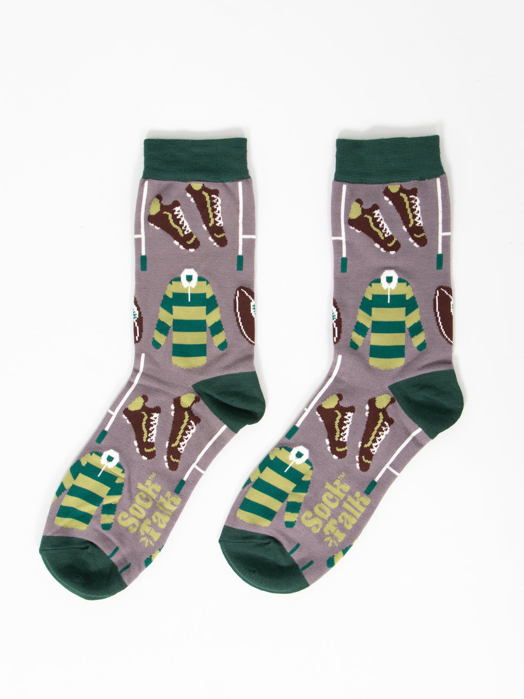 showing the socks laying flat, they have a grey background and dark green heel, toe and cuff. the rugby themed pattern covers the whole of the design