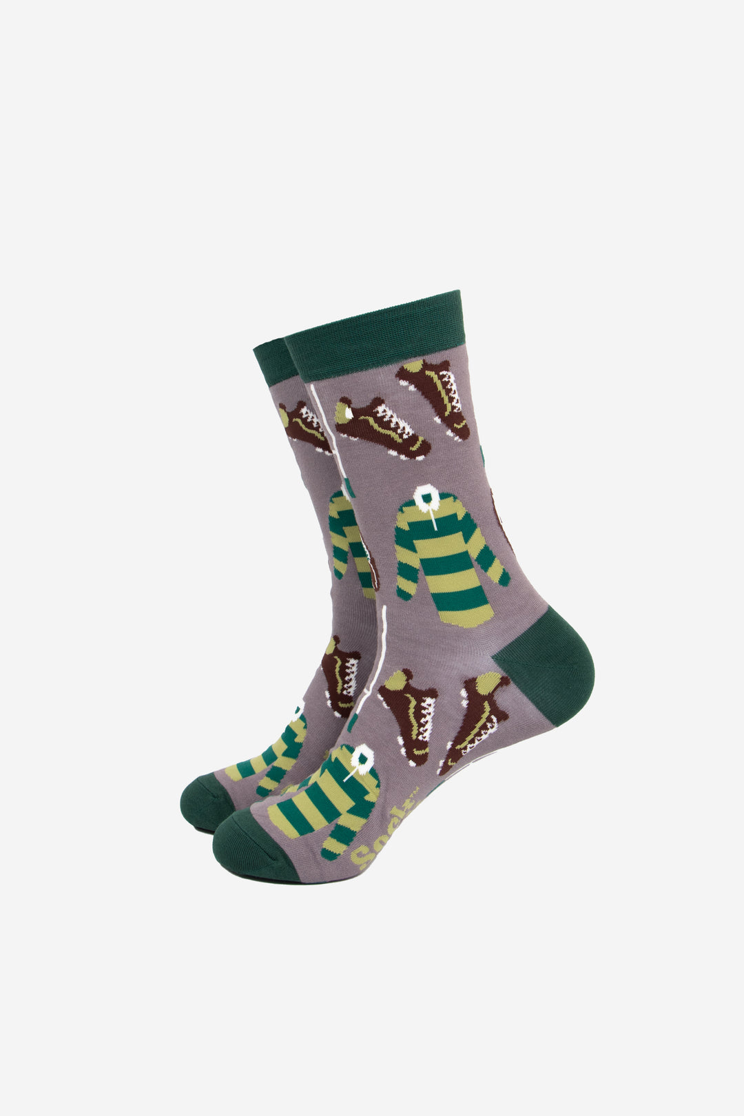 grey bamboo socks with green heel, toe and cuff, there is a pattern of green striped rugby shirts, brown rugby boots and white goals all over the design