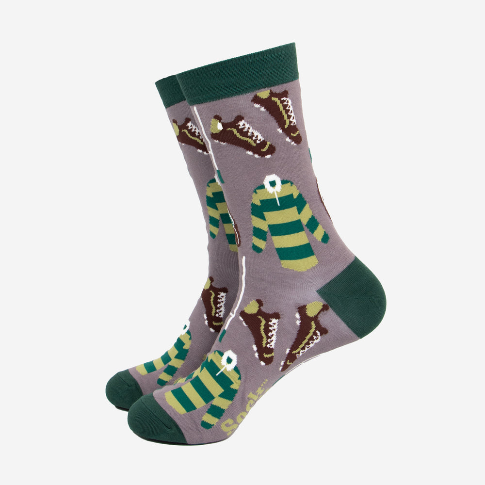 men's grey bamboo socks with a dark green heel, toe and cuff. The crew socks have a repeating pattern featuring rugby goals, rugby boots and green striped rugby shirts. 