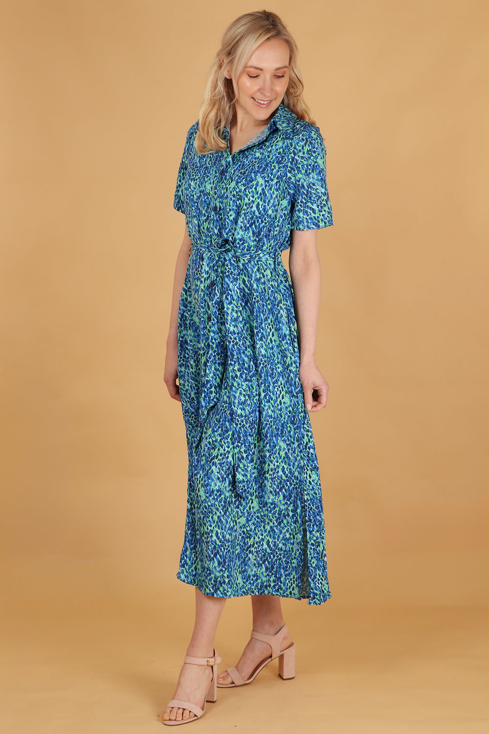 model wearing a blue abstract print short sleeve shirt dress